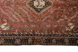 Corner detail of 2000s Shiraz rug showing border pattern and Wool pile
