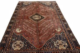 Surface texture of 2000s Shiraz rug with natural Wool and intricate pattern