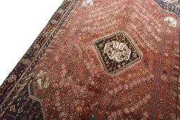 Backside of handmade 2000s Shiraz rug showing knot structure and weave density