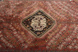 Central medallion detail of 2000s Shiraz rug from Iran / Persia