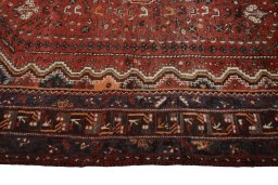 Corner detail of 2000s Shiraz rug showing border pattern and Wool pile