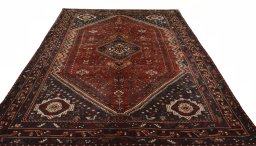 Surface texture of 2000s Shiraz rug with natural Wool and intricate pattern