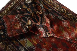 Corner detail of 2000s Shiraz rug showing border pattern and Wool pile