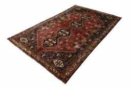 Corner detail of 2000s Shiraz rug showing border pattern and Wool pile