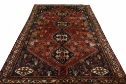Surface texture of 2000s Shiraz rug with natural Wool and intricate pattern