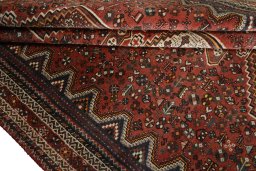 Corner detail of 2000s Shiraz rug showing border pattern and Wool pile
