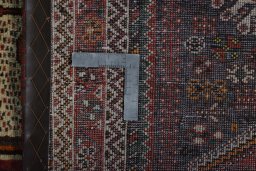 Surface texture of 2000s Shiraz rug with natural Wool and intricate pattern
