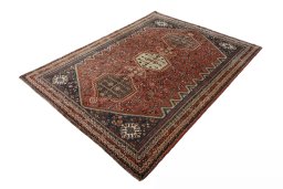 Corner detail of 2000s Shiraz rug showing border pattern and Wool pile