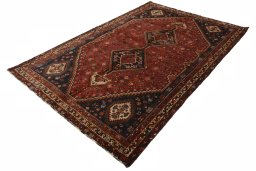 Corner detail of 2000s Shiraz rug showing border pattern and Wool pile