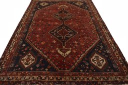 Surface texture of 2000s Shiraz rug with natural Wool and intricate pattern