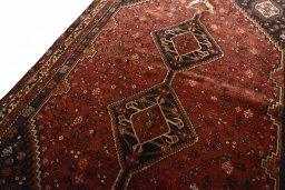 Backside of handmade 2000s Shiraz rug showing knot structure and weave density