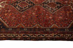 Full view of 2000s Shiraz rug from Iran / Persia, 278 × 186 cm in Red tones