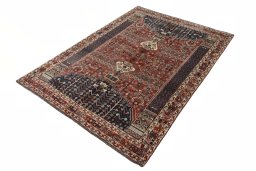 Corner detail of 2000s Shiraz rug showing border pattern and Wool pile