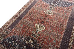 Backside of handmade 2000s Shiraz rug showing knot structure and weave density
