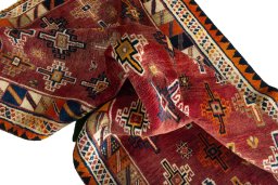 Corner detail of 2000s Shiraz rug showing border pattern and Wool pile