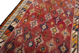 Backside of handmade 2000s Shiraz rug showing knot structure and weave density
