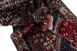 Corner detail of 2000s Shiraz rug showing border pattern and Wool pile