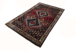 Corner detail of 2000s Shiraz rug showing border pattern and Wool pile