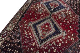 Backside of handmade 2000s Shiraz rug showing knot structure and weave density