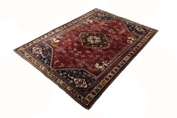 Corner detail of 2000s Shiraz rug showing border pattern and Wool pile