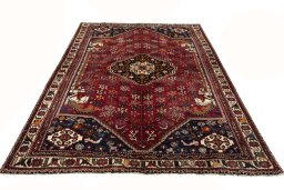 Surface texture of 2000s Shiraz rug with natural Wool and intricate pattern