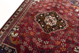 Backside of handmade 2000s Shiraz rug showing knot structure and weave density