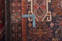 Surface texture of 2000s Shiraz rug with natural Wool and intricate pattern