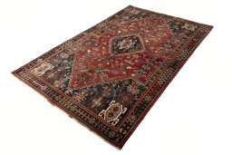 Corner detail of 2000s Shiraz rug showing border pattern and Wool pile