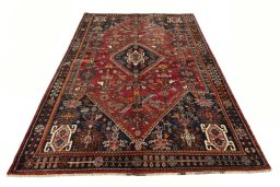 Surface texture of 2000s Shiraz rug with natural Wool and intricate pattern
