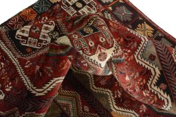 Corner detail of 2000s Shiraz rug showing border pattern and Wool pile