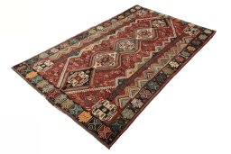 Corner detail of 2000s Shiraz rug showing border pattern and Wool pile
