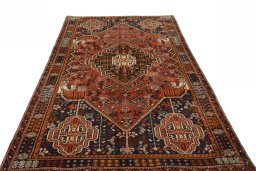 Surface texture of 2000s Shiraz rug with natural Wool and intricate pattern