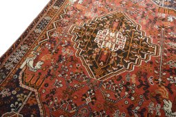 Backside of handmade 2000s Shiraz rug showing knot structure and weave density