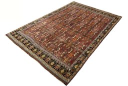 Corner detail of 2000s Shiraz rug showing border pattern and Wool pile
