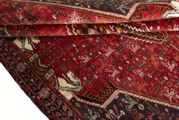 Corner detail of 2000s Shiraz rug showing border pattern and Wool pile