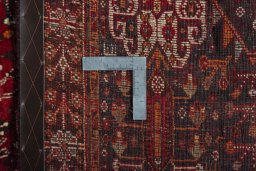 Surface texture of 2000s Shiraz rug with natural Wool and intricate pattern
