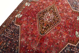 Backside of handmade 2000s Shiraz rug showing knot structure and weave density