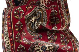 Corner detail of 2000s Shiraz rug showing border pattern and Wool pile