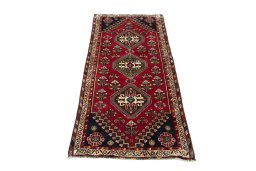 Surface texture of 2000s Shiraz rug with natural Wool and intricate pattern