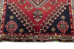 Central medallion detail of 2000s Shiraz rug from Iran / Persia