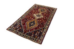 Corner detail of 2000s Shiraz rug showing border pattern and Wool pile