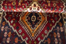 Full view of 2000s Shiraz rug from Iran / Persia, 187 × 110 cm in Red tones