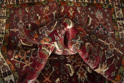 Corner detail of 2000s Shiraz rug showing border pattern and Wool pile