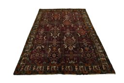 Surface texture of 2000s Shiraz rug with natural Wool and intricate pattern