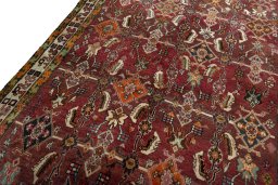 Backside of handmade 2000s Shiraz rug showing knot structure and weave density