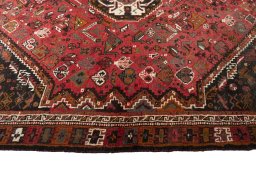 Corner detail of 2000s Shiraz rug showing border pattern and Wool pile