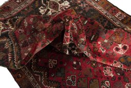 Surface texture of 2000s Shiraz rug with natural Wool and intricate pattern