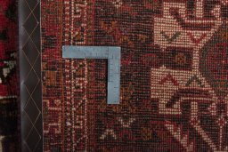 Backside of handmade 2000s Shiraz rug showing knot structure and weave density