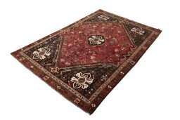 Corner detail of 2000s Shiraz rug showing border pattern and Wool pile