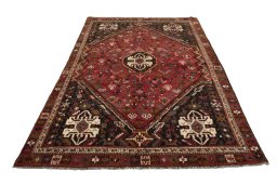 Surface texture of 2000s Shiraz rug with natural Wool and intricate pattern